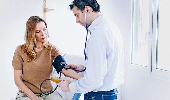Low blood pressure: Feeling sick and dizziness among symptoms of the ...
